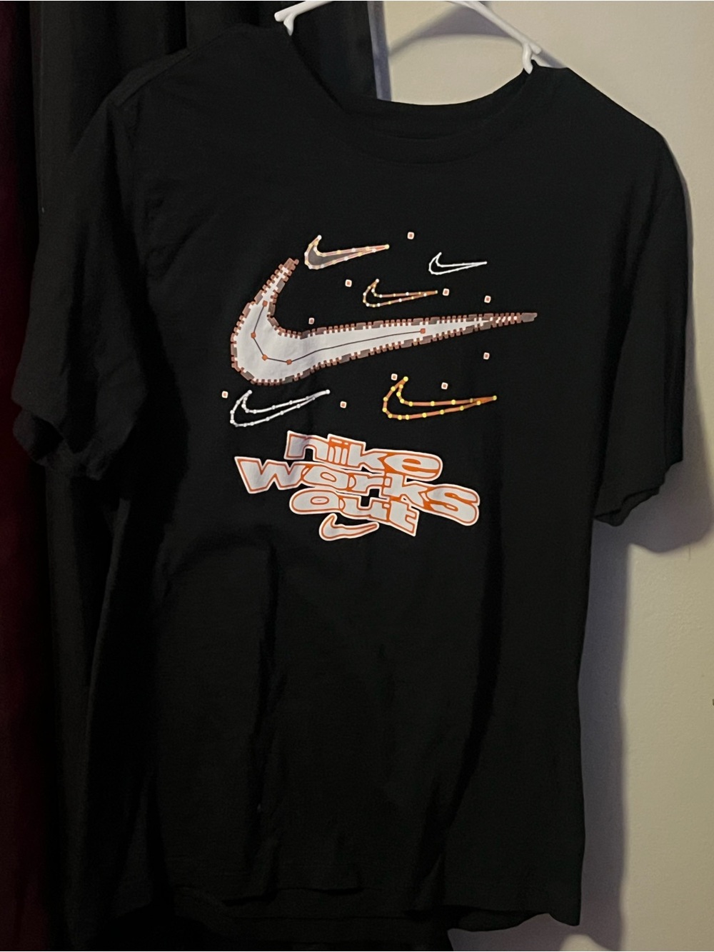 Nike Black Tee with White and Orange Swoosh Graphics